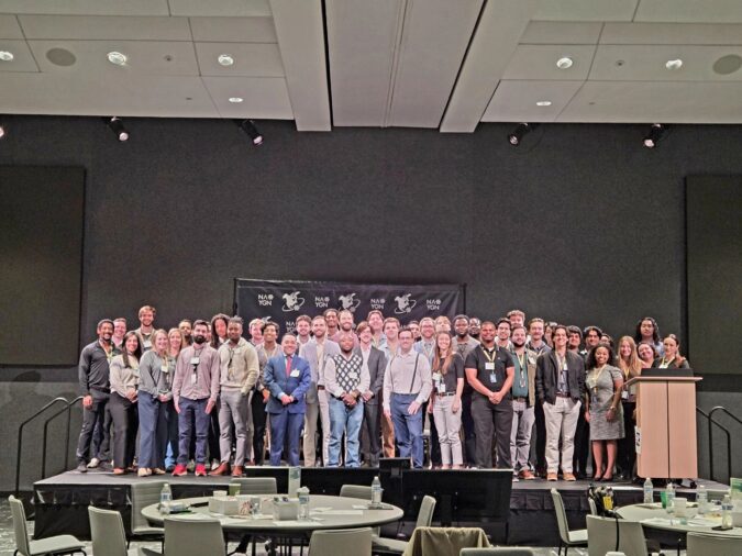 A group of people standing on a stage