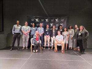 A group of people standing on a stage